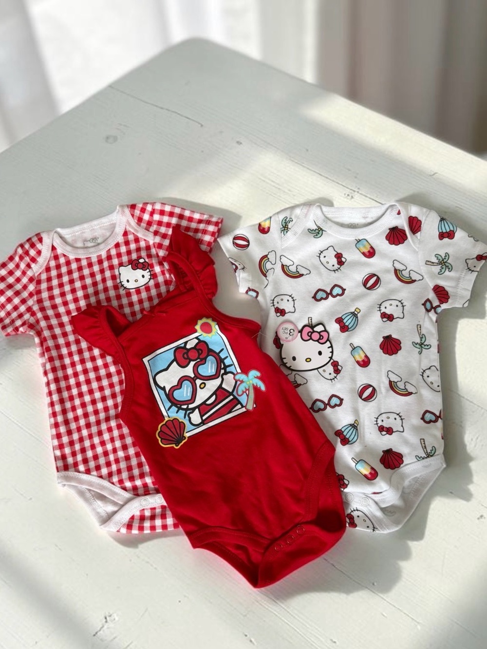 Hello Kitty Red & White Mixed Print Baby One-Piece Set